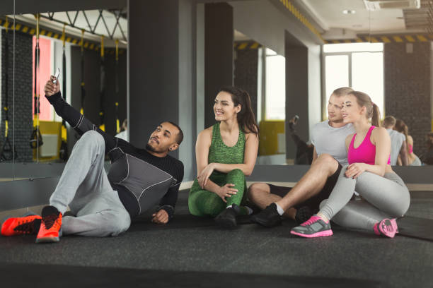 istock Young multiethnic group making selfie at gym 950780860