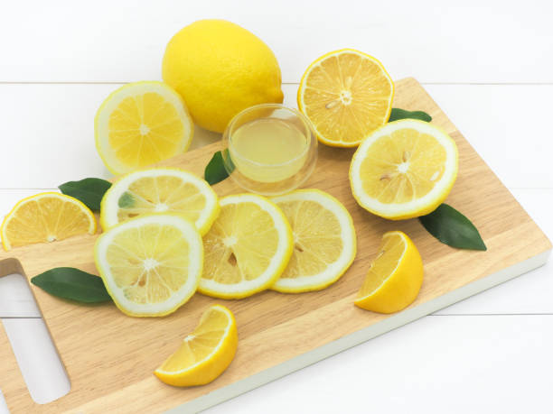 istock Fresh lemon slice with lemonade on white wood background 950783188