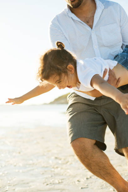 istock Father and daughter having fun outdoors 950787336