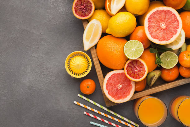 istock Variety of ripe citruses on gray background 950787722