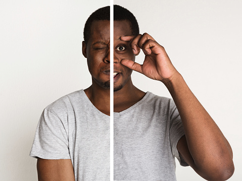 Collage of young african-american man portraits with double face expression on white studio background. Double personality, bipolar disorder concept