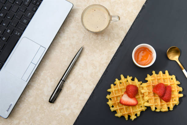 istock flat lay with a working breakfast and coffee with laptop 950788128