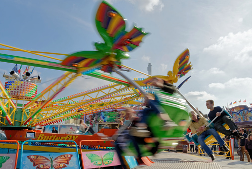 Braunschweig, Lower Saxony, Germany - April 15, 2018: Fast and high-flying carousel at the fair, motion blur