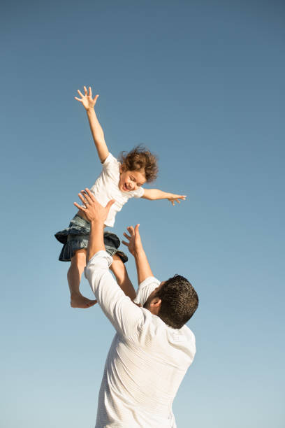 istock Father and daughter having fun outdoors 950788572