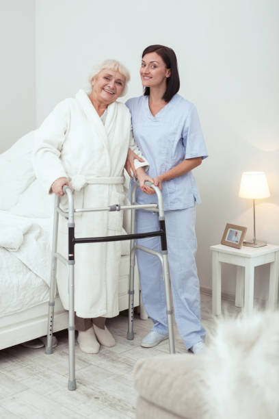 istock Jolly elder woman walking with walker 950790748
