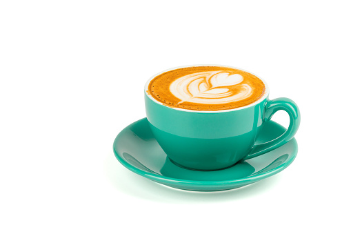 Hot latte coffee with latte art in a green cup isolated on white background with clipping path.
