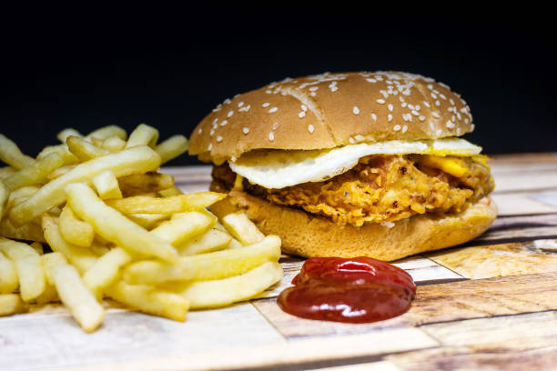 istock Cheese burger - American cheese chicken burger with fresh salad 950791852