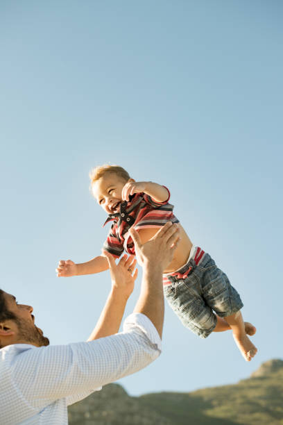 istock Father and son having fun outdoors 950791920