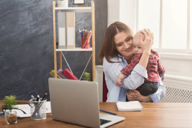 istock Young working mother spending time with baby 950791934