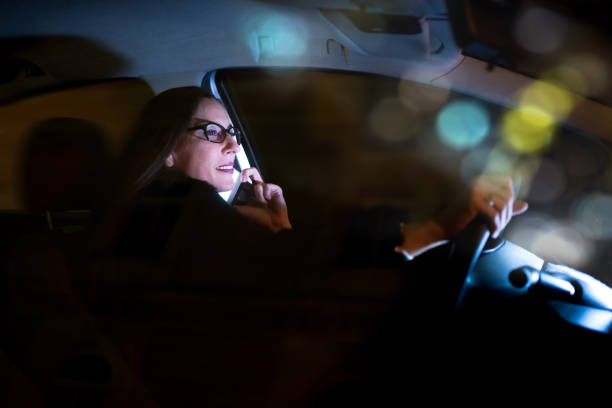 istock Business woman using smartphone in the car 950792146