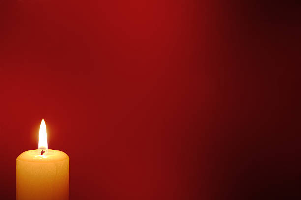 Burning candles on a black background