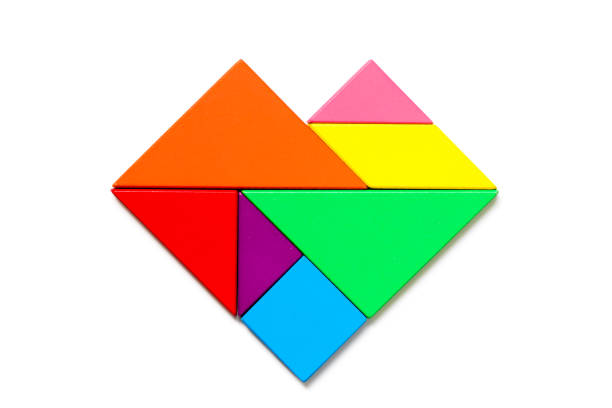 istock Color wood tangram puzzle in heart shape on white background 950796514