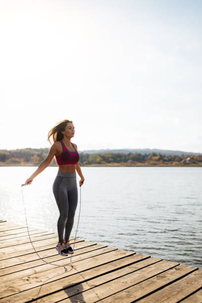 istock Fit young woman skipping a rope 950797080