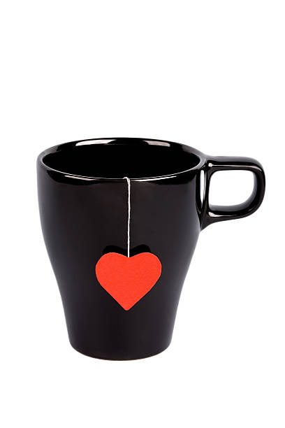 istock Tea bag with heart-shaped label in cup isolated 95079812
