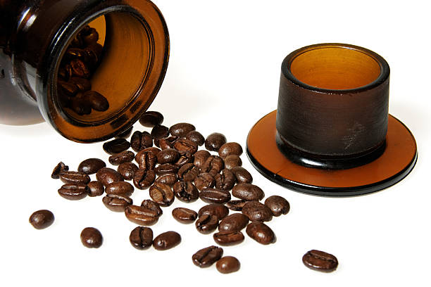 istock Scattered coffee beans from vintage jar 95079835