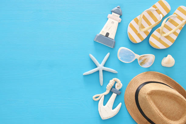 istock vacation and summer image with sea life style objects over blue wooden background. 950801628