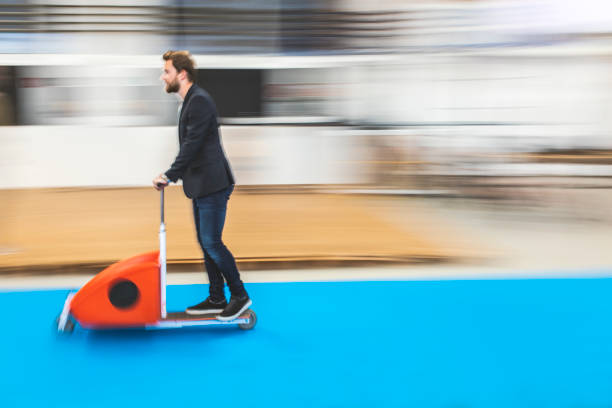 istock Young businessman riding a scooter 950802014