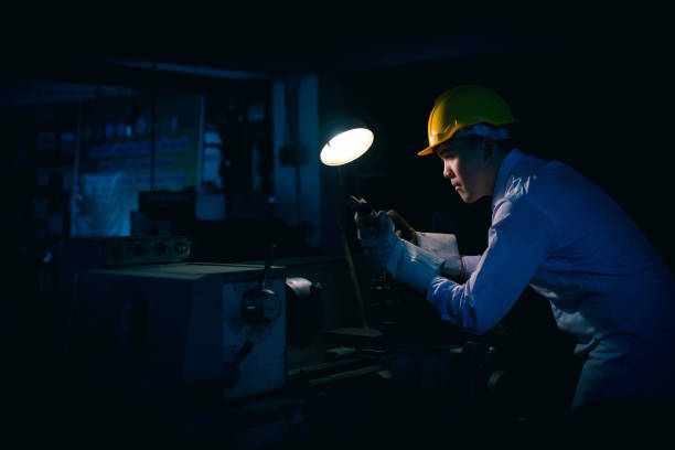 istock Asian engineer man wearing safety helmet checking and using an equipment in the laboratory. concept of manufacturing mechanical workshop measurement and tools. 950803056