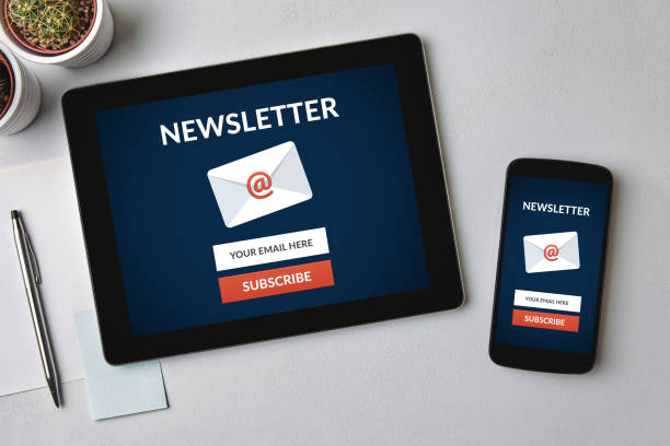 Subscribe newsletter concept on tablet and smartphone screen Subscribe newsletter concept on tablet and smartphone screen over gray table. All screen content is designed by me. Flat lay newsletter stock pictures, royalty-free photos & images