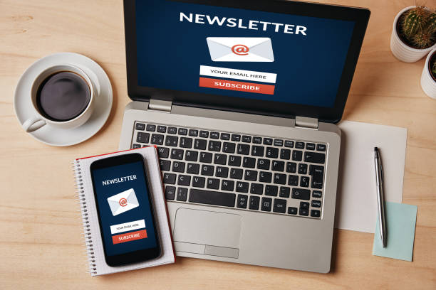 Subscribe newsletter concept on laptop and smartphone screen Subscribe newsletter concept on laptop and smartphone screen over wooden table. All screen content is designed by me. Flat lay newsletter stock pictures, royalty-free photos & images