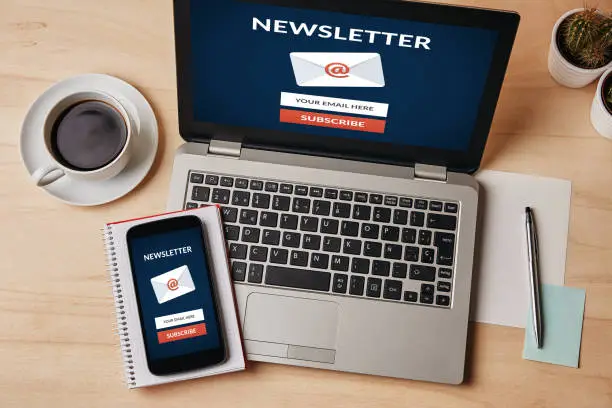 Photo of Subscribe newsletter concept on laptop and smartphone screen