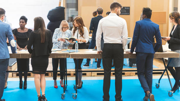 Business team working Business team working at a standing desk in a modern office building standing desk photos stock pictures, royalty-free photos & images