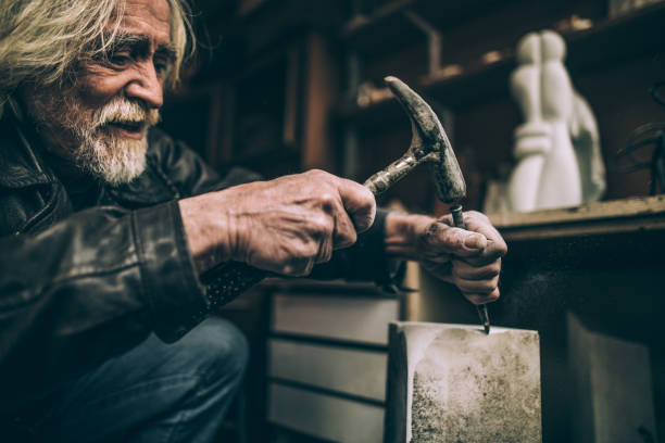 istock Happy senior artist making artwork 950815770