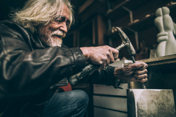istock Happy senior artist making artwork 950815774