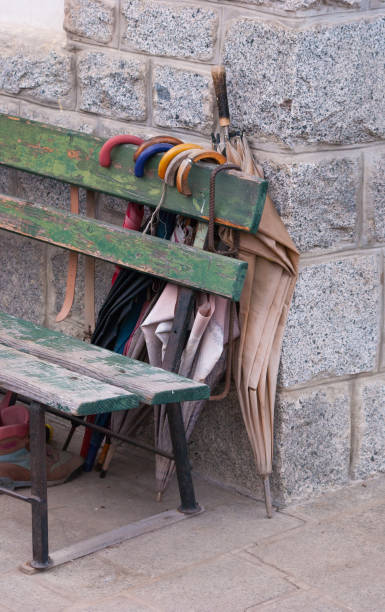 istock Very used bench with many umbrellas 950817460