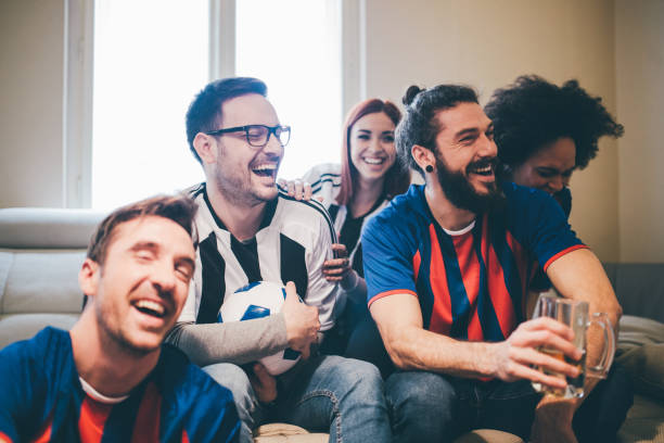 istock Multi-gender group of soccer fans watching a game 950819970
