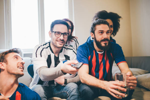 istock Multi-gender group of soccer fans watching a game 950820002