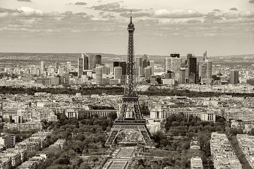 Eiffel Tower against La Defense district in sepia