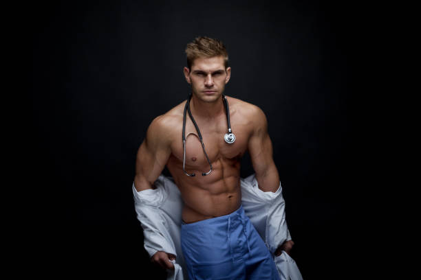 sexy male doctor undressing - male stripper imagens e fotografias de stock