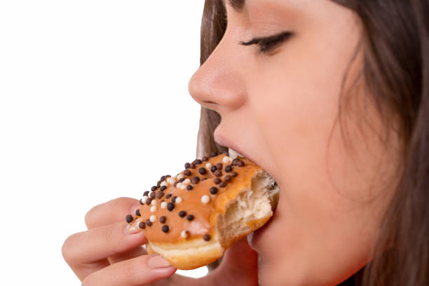 istock Beautiful sensual woman, eating a donut 950826920