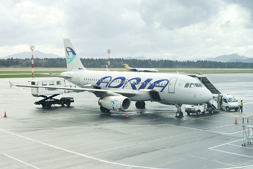Ljubljana, Slovenia - March 30, 2108: Adria Airways Airbus A319-132 with identification S5-AAR is preapared for next flight at Ljubljana airport.