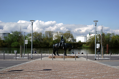 Ruesselsheim, Germany - April 11, 2018: The sculpture Rider with market ship of the artist Detlef Kraft on the banks of the Main on April 11, 2018 in Ruesselsheim.