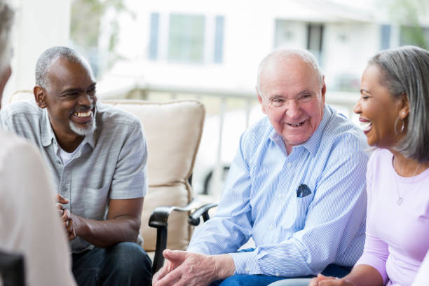 istock Group of seniors enjoy talking with one another 950832382
