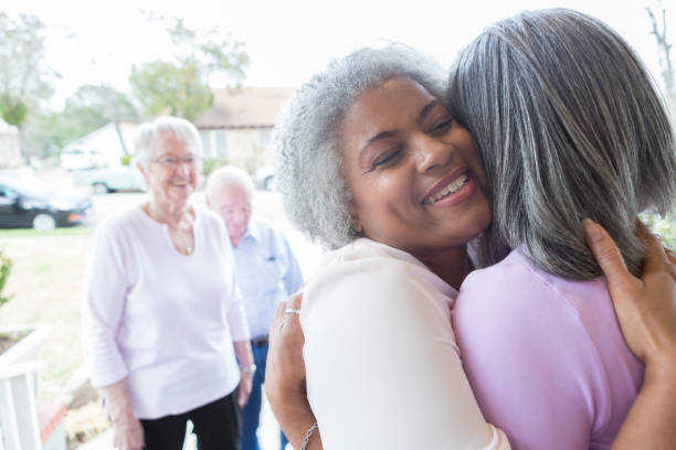 istock Happy woman greets neighbor 950832416