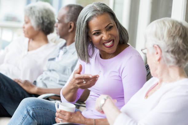 istock Active seniors visit with one another in retirement community 950832432