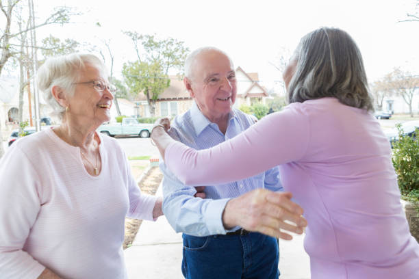 istock Senior woman greets guests 950832442