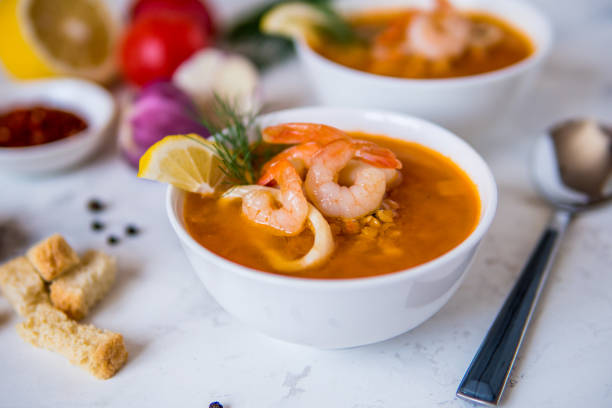 istock Lentil soup with seafood. Red soup with shrimps and squid, copy space 950836412