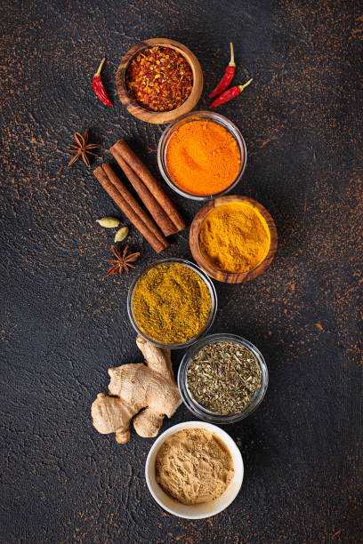 istock Traditional Indian spices on rusty background 950841318