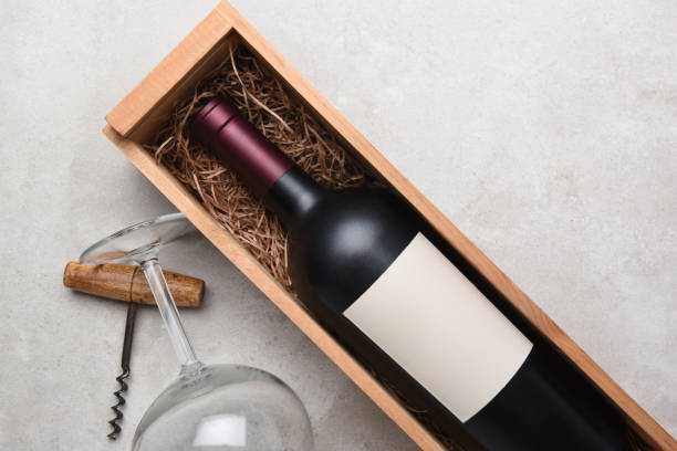 istock Red Wine bottle in wood case with glasses and corkscrew 950841362