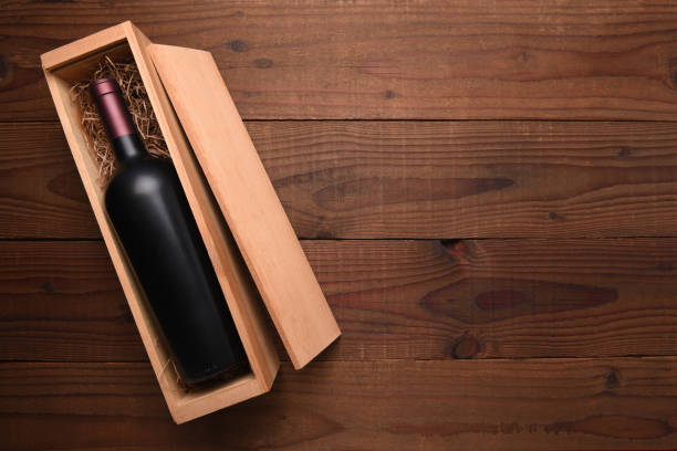 istock A single Bottle of red wine in its wooden case 950841470