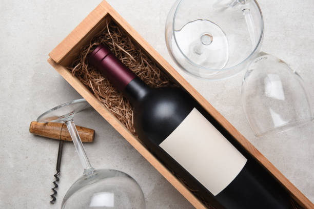 istock Cabernet bottle in wood case with glasses and corkscrew 950841690