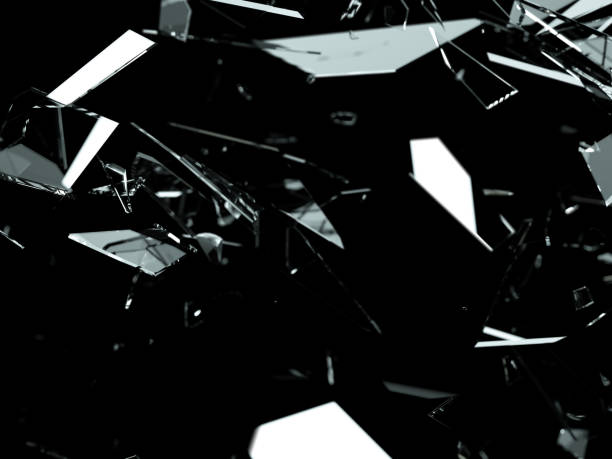 Pieces of splitted or cracked glass on black.