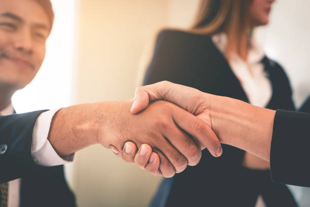 istock Happy business man with confidence hand shake with partner 950851562