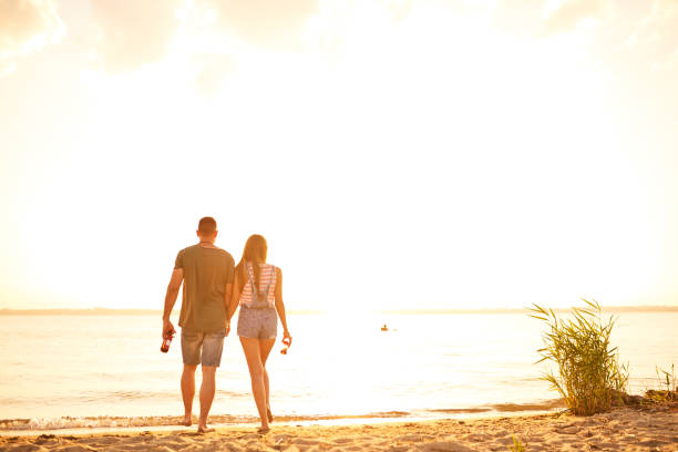 istock Romantic couple walking over beach during date 950854456