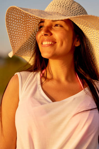 istock Cheerful dreamy woman contemplating sunset 950854474