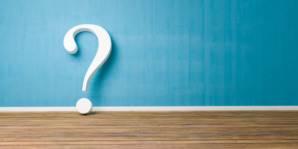 istock White question mark at blue concrete grunge Wall 950860858